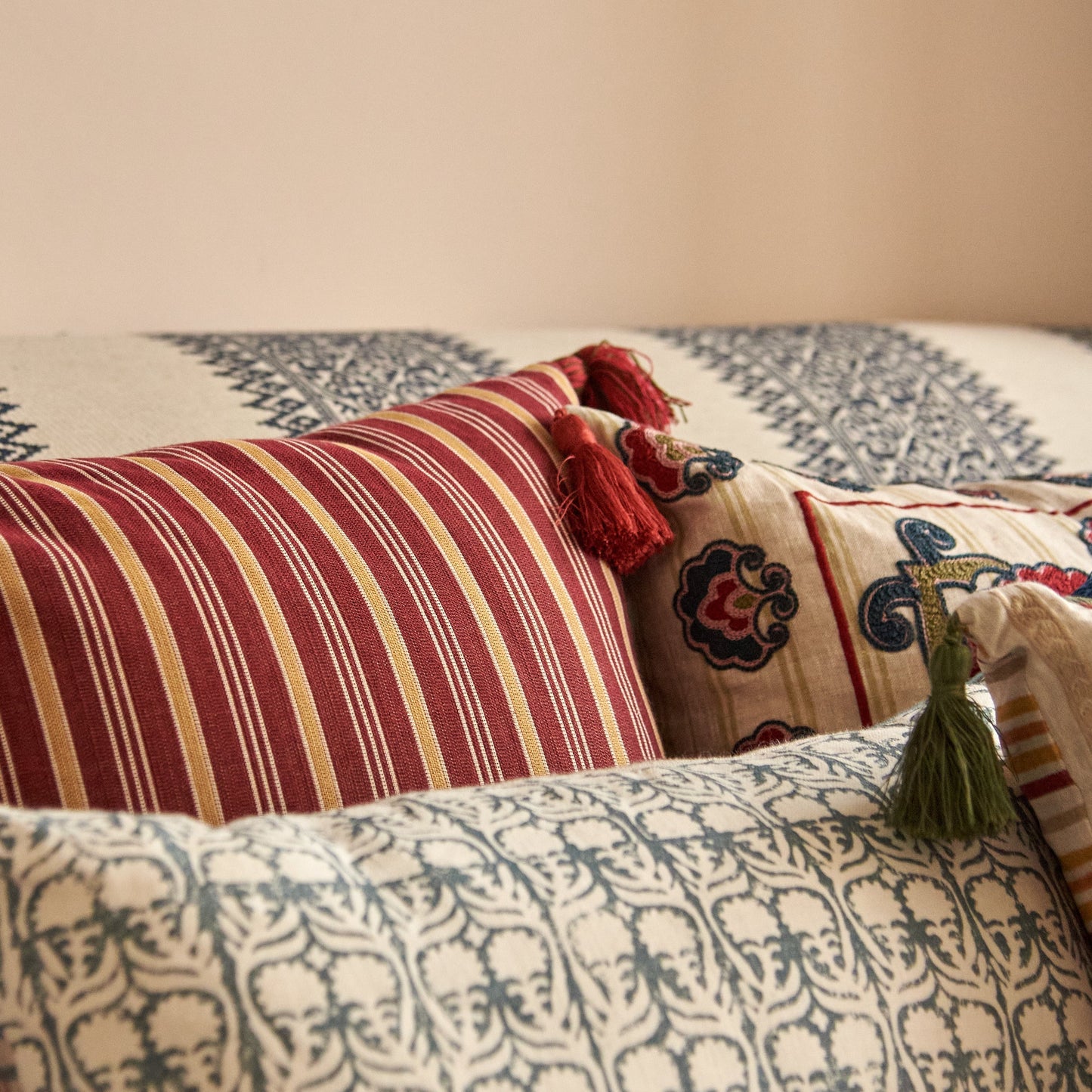 Rumeli and Meknes Stripe Cranberry Old Gold Cushion with Red Tassels